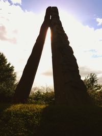 Low angle view of statue against sky during sunset