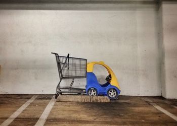 Close-up of bicycle against wall