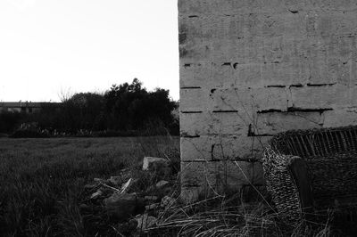 Abandoned field against clear sky