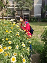 Woman and flowering plants