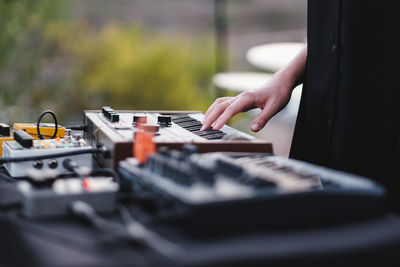 Midsection of woman playing keyboard instrument