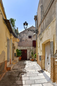 A narrow street among the old houses of irsina in basilicata, region in southern italy.