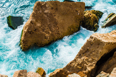 Close-up of rocks at shore