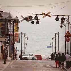 Street light against cloudy sky