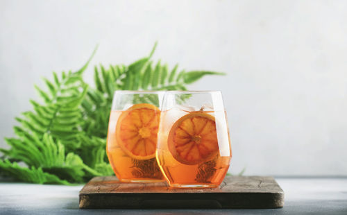 Close-up of orange juice in glass on table