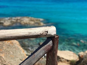Close-up of wood against sea
