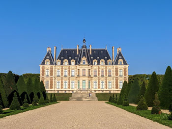 View of historical and a beautiful palace of sceaux in paris  against clear blue sky 