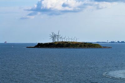 Small island in front of the windfarm outside copenhagen habour.