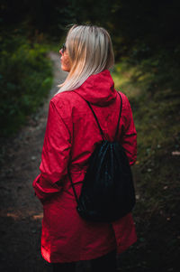 Rear view of woman standing outdoors