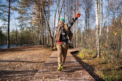 Rear view of man standing in forest