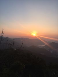 Scenic view of mountains against sky during sunset
