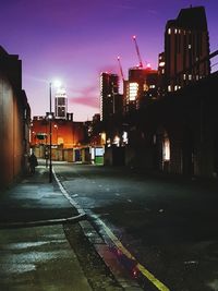 Illuminated city street at night