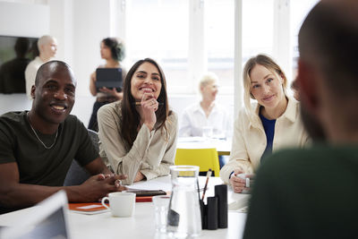 Group of business people discussing project in office