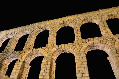 Low angle view of historical building against sky at night