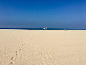 Scenic view of beach against clear sky