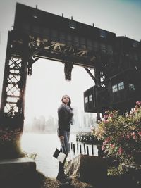 Woman standing in front of wall