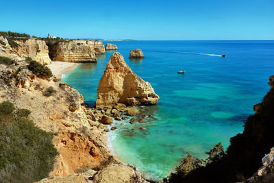 Scenic view of sea against clear blue sky