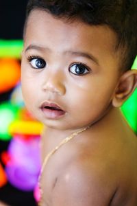 Portrait of shirtless baby boy at home