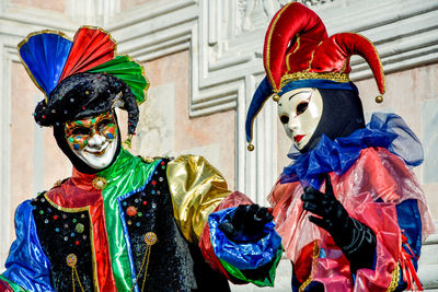 People wearing masks and costumes during carnival