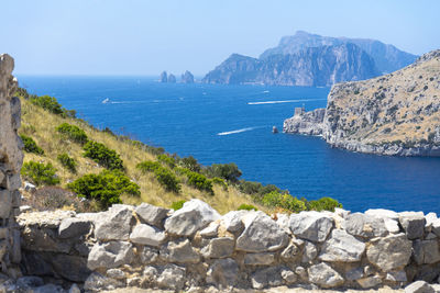 Scenic view of sea and rocks against sky