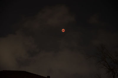 Low angle view of moon in sky at night