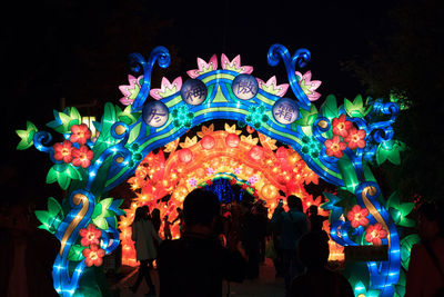 People in traditional clothing at night