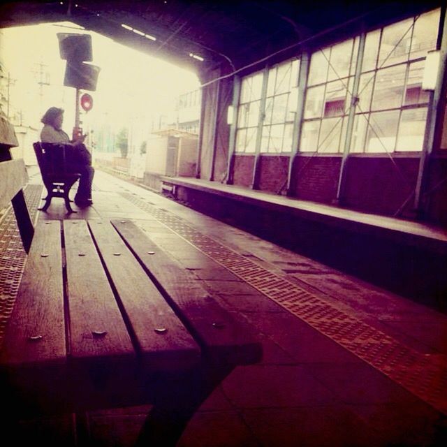 indoors, architecture, built structure, empty, flooring, window, reflection, absence, ceiling, glass - material, railroad station, illuminated, red, day, railroad station platform, interior, tiled floor, lighting equipment, modern, wall - building feature