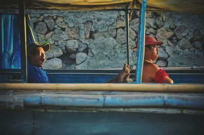 People sitting by window