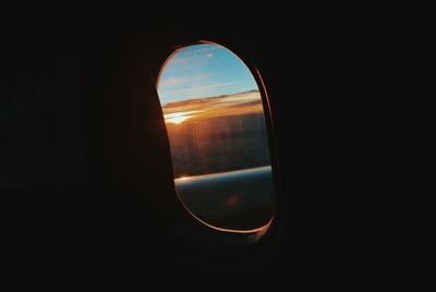 View of sunset through window