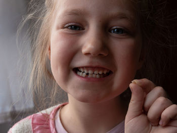 Close-up portrait of cute girl smiling