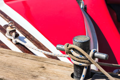 Boat tied with a rope in the port. horizontal image.