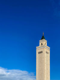 Low angle view of building against blue sky