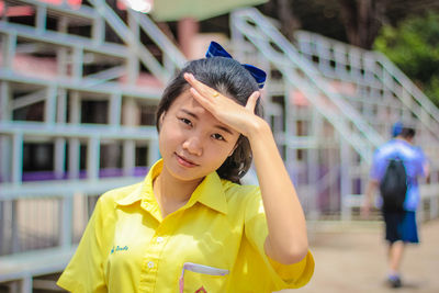 Portrait of young woman at playing field