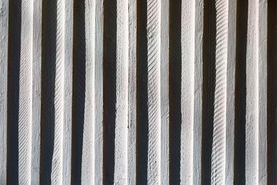 Full frame shot of patterned wall on sunny day