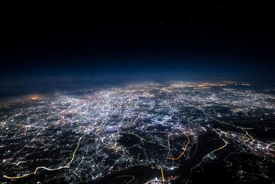 High angle view of illuminated city at night