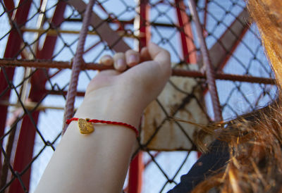 Close-up of woman hand with arms raised