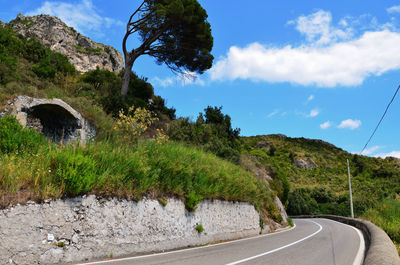 Scenic view of mountain road against sky