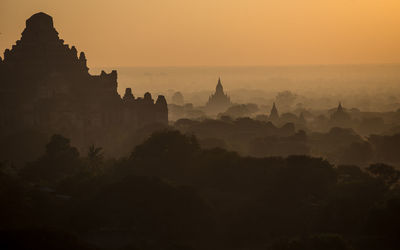 Aerial view of temple against sky during sunset