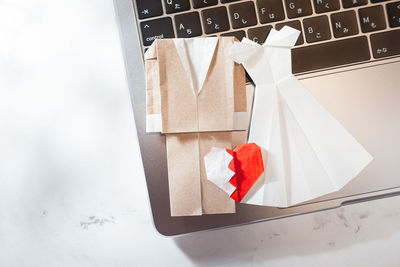 High angle view of red umbrella on white table
