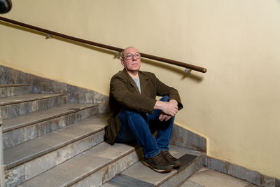 Low angle view of man standing on staircase