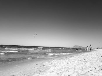 Scenic view of beach against clear sky