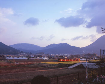 High angle view of buildings in town against sky