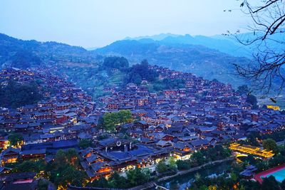 High angle view of townscape and mountains against sky