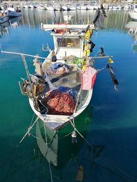 High angle view of fishing boats moored in lake