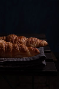 Close-up of breakfast on table against black background