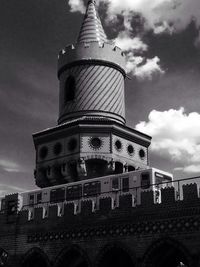 Low angle view of cathedral against cloudy sky