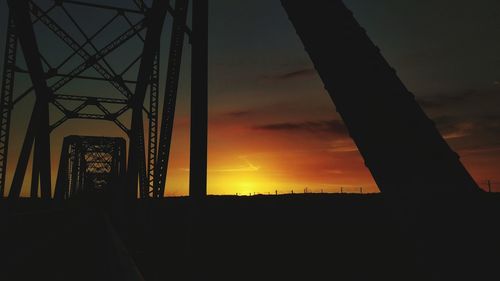 Silhouette of bridge against sky during sunset