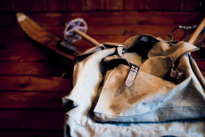 Low angle view of old backpack hanging on wall