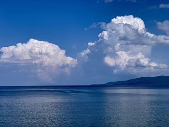 Scenic view of sea against blue sky