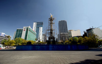 Modern buildings in city against sky